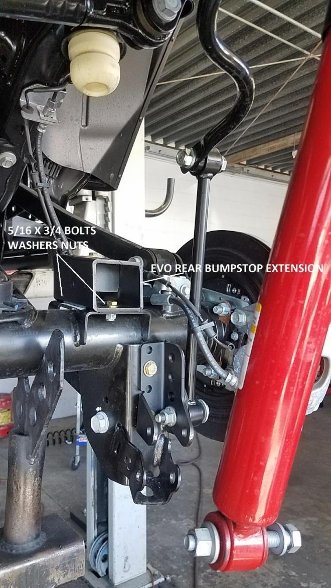REAR Install 23. Safely and securely park vehicle on level ground with parking brake applied. 24. Use wheel chokes to block front tires from rolling 25. While safely parked on ground.