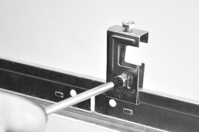 Attach side B Brackets to the main runners of the suspended ceiling using screws provided. Lightly tighten side screws to hold brackets on the ceiling grid rails. 7.