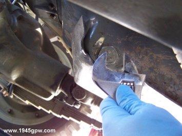 Remove the oil pan plug by turning the plug counter