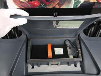 You can open the compartment as shown on the