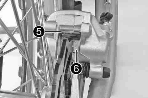 B00357-10 Remove locking split pins, withdraw pin, and take out the brake linings. Clean the brake caliper and brake caliper support.