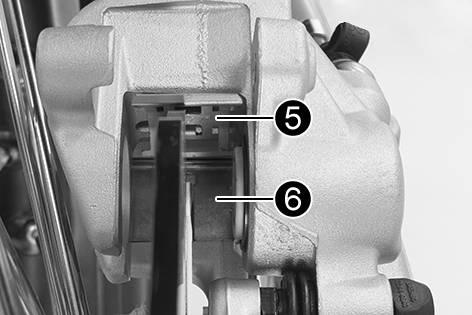 H00324-10 Remove cotter pins, pull out pin, and remove the brake linings. Clean the brake caliper and brake caliper support.
