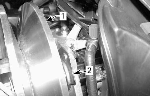 Upper gear retaining tool 10. Remove the drive belt from driven pulley. 11.