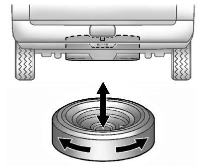 1. Put the tire on the ground at the rear of the vehicle with the valve stem pointed down, and to the rear. 2. Pull the cable and spring through the center of the wheel.
