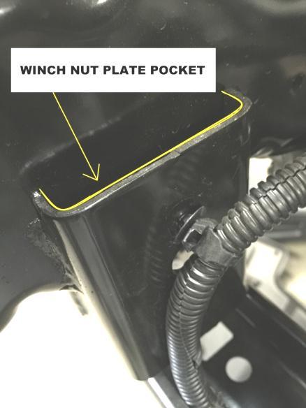 The winch plate spacer should be positioned in-between the EVO winch plate and factory frame