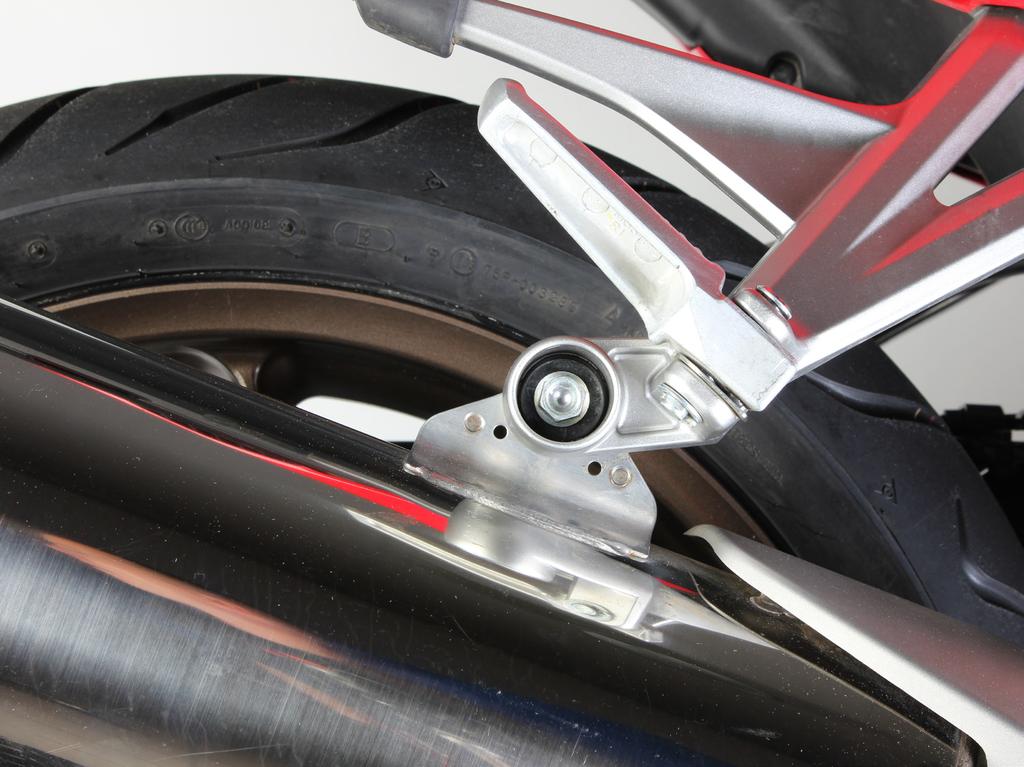 Loosen the marked clamp (Figure 1). CAUTION: be careful not to damage any part of the motorcycle during this process!