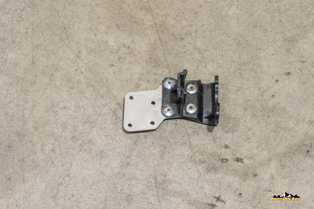Oil System Using supplied rivets, attach factory oil pump bracket to provided relocation mount, as shown.
