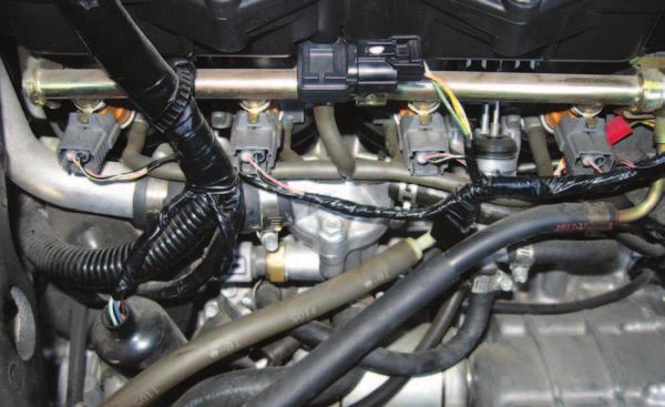 right. FIG.F 14 Locate the Throttle Position Sensor (TPS) connector.