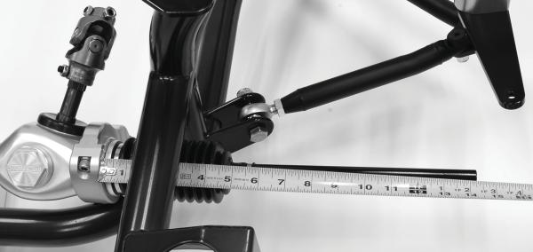 On the driver side, measure from the rack-mount clamp to the end of the tie-rod. Record this as Measurement A. 24. Turn the rack toward the driver side until it stops at the full-lock position.