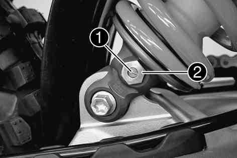 MAINTENANCE WORK ON CHASSIS AND ENGINE 35 Turn adjusting screw clockwise with a screwdriver to the last click. Do not loosen nut!