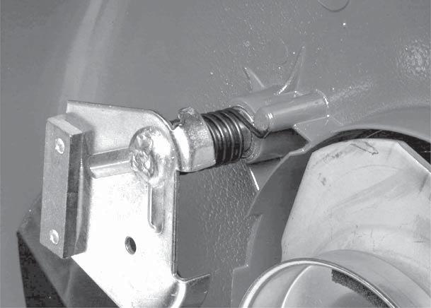 8. Slip the spring over the shaft. One tang of the spring must engage the tab as shown (Fig. 98). 0. Hold the idler/brake arm in place.