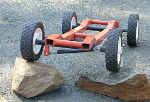 Here is another method to deal with the situation: Just move a second rock, or a pile of small rocks in front of the left front tire and have both wheels climb equally, keeping the vehicle level -