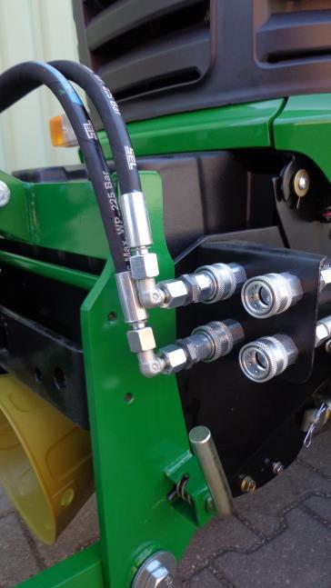 Hook the front power system into the receptacle slots on the tractor frame 4.