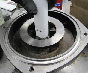 Position the seal onto the shaft with the shiny