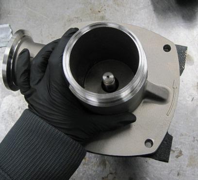 13. Carefully install the inlet flange casting over the shaft and onto the mounting flange.