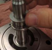 With the seal lip facing the large end of the shaft, slide the seal over the threaded