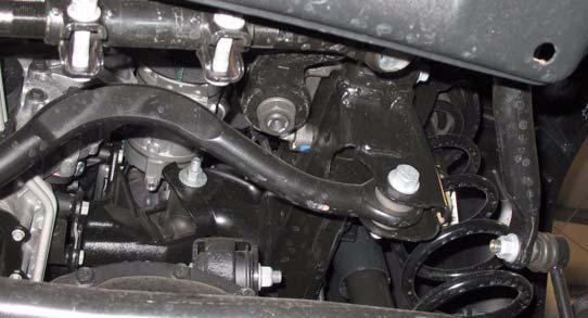 Before removing the coil springs, lower the axle housing as far as possible to allow the coil springs to expand. 1.