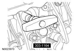 Fig. 203: Identifying Special Tool (303-1164) Early build cylinder heads, head gaskets, cylinder block, rocker arm carriers and injector hold-down clamps are not interchangeable with late build