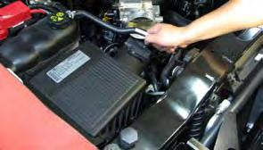 Install the supplied silicone elbow onto the airbox cover, ensuring that the