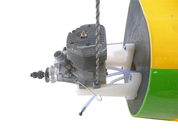 MOUNTING THE ENGINE - 20CC. 1) Position the engine with the drive washer (145mm) forward of the firewall as shown.