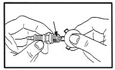 4. 5. Using a spark plug wrench, remove the spark plug. Inspect the Spark Plug: If the electrode is oily, clean it using a clean, dry rag.