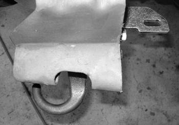45. Make a second cut line along to remove the front 'bumper' protruding from the face of the bracket. Figure 20C. Cut the 'bumper' off with a reciprocating saw. Paint any exposed metal.