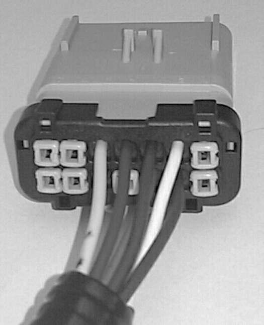 14. Relocate the wires and plugs from the Black connector to the Gray connector as described in step 4, except cut and remove the Violet wire jumping from pin 7 to pin 1. (See Figure 12.