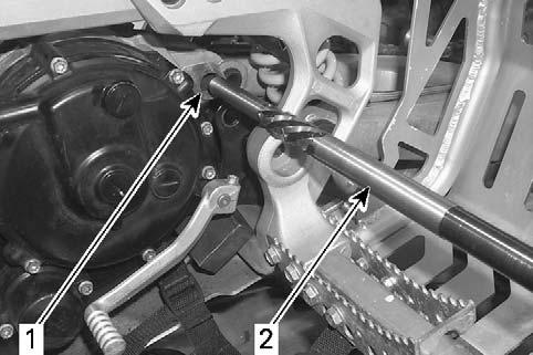 New Sleeve Installation Procedure 1. Drill the crankcase swing arm pivot hole using the drill bit. Set-up: 1.1 Drill from the left side of the vehicle. 1.2 Drill speed should be approximately 500 RPM.