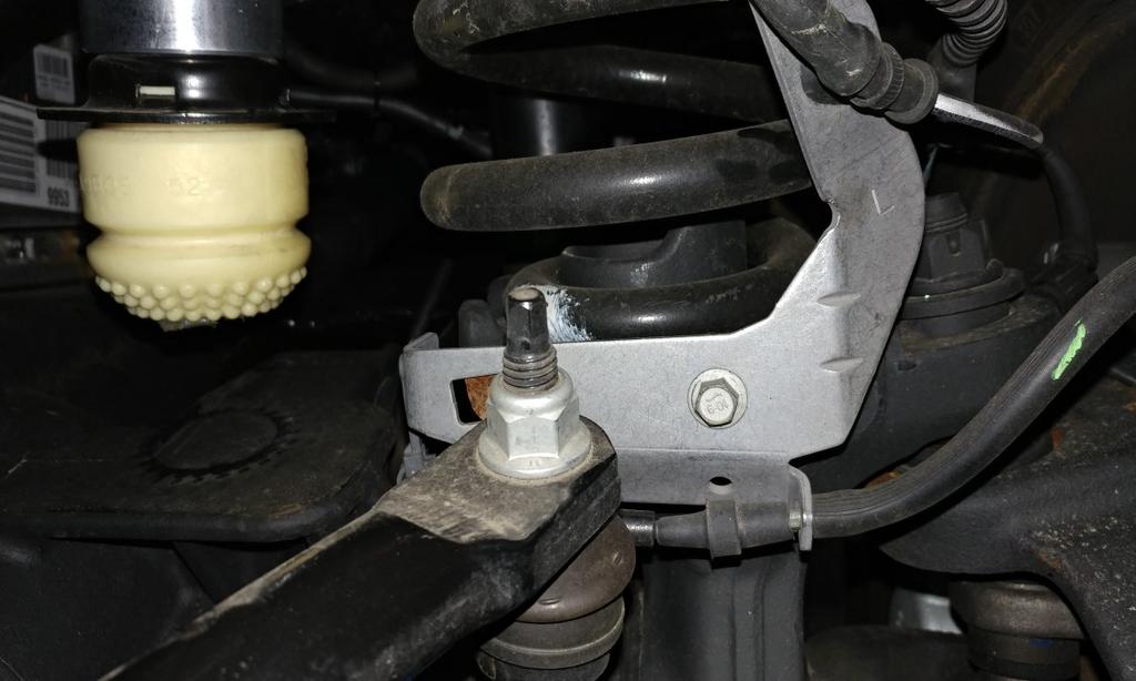 Reattach the factory brake line bracket at the axle using factory hardware. Torque to 5 ft-lbs.