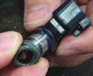 Carefully lower the manifold onto the engine so that the bushings set properly onto the cylinder heads.