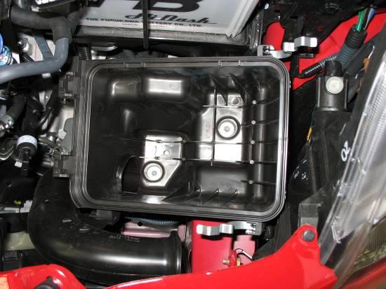 Remove the air box lid and intake tube from the engine bay.