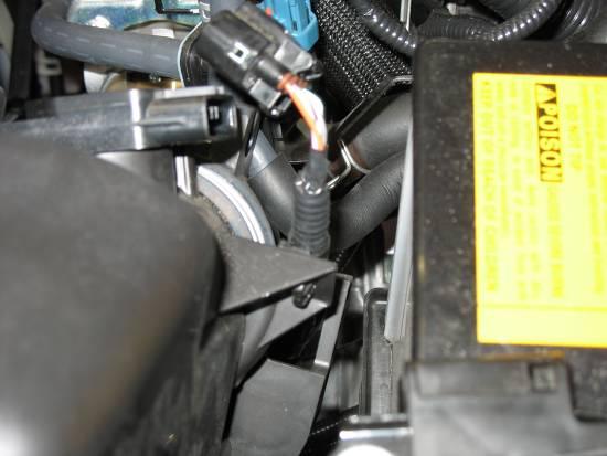 h) Remove the two lower air box mounting bolts.
