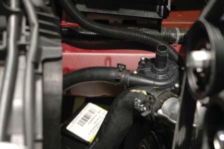 157. Route the passenger side hose from the intercooler heat exchanger up into the engine