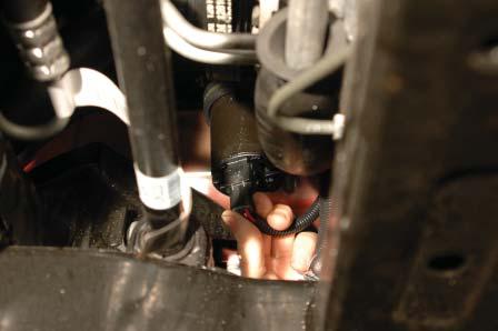 177. Route the intercooler pump plug around the fuse center and down toward the intercooler pump.