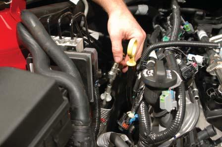 L99 Engines: Disconnect the hose from the sensor at the brake booster valve using a pair of pliers on the existing clamp. 26.