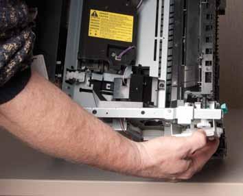 Remove duplex-drive gears (duplex models) or face-down gears (simplex models): Simplex and duplex printers have different gear assemblies, but the removal procedure is the same for both.