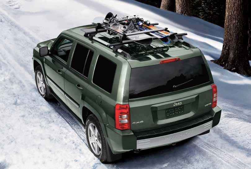 ROOF-MOUNT SKI AND SNOWBOARD CARRIER. Convenient carrier holds up to six pairs of skis, four snowboards, or a combination of the two.