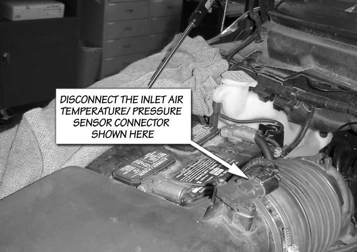 Intercooler Assembly Installation 1. Disconnect the negative battery cables from both batteries 2. Disconnect the Inlet Air Temperature/ Pressure Sensor connector located on the air box cover.