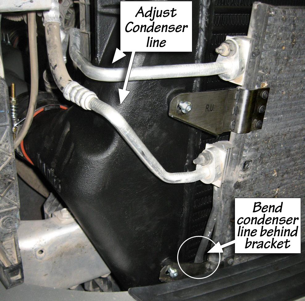 Figure 6 28. Install the passenger side boost tube. The passenger side uses a 2.75 inch diameter straight hose at the turbocharger connection, and a 3.5 inch diameter hump hose at the CAC connection.