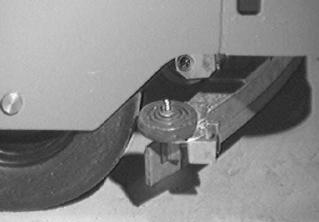TO ADJUST REAR SQUEEGEE GUIDE ROLLER On the left end of the squeegee is a guide roller that guides the squeegee blade end along a wall.