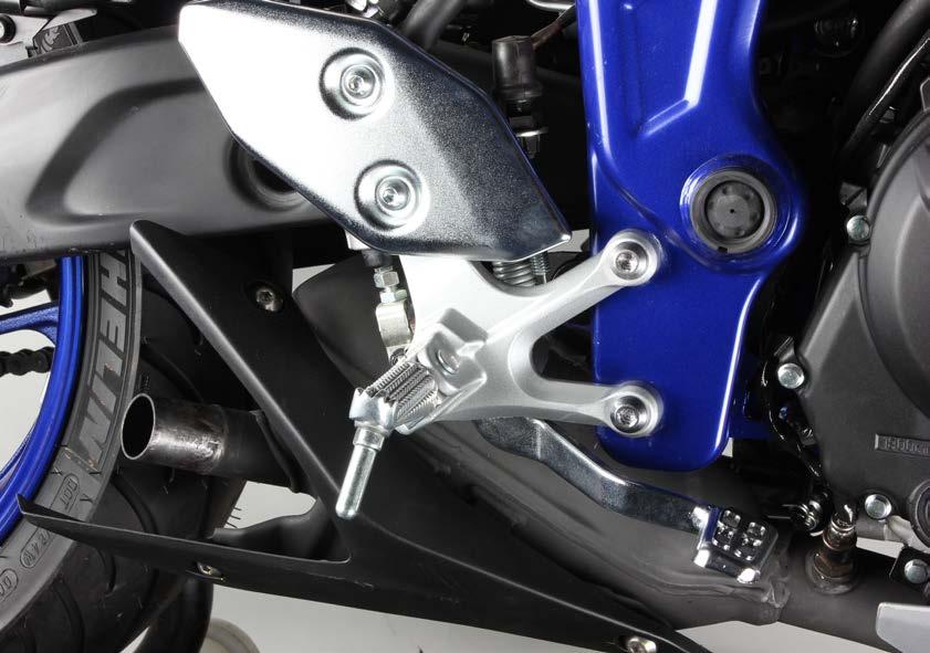 3. Unscrew the marked bolts and carefully move the right riders foot rest out of the way (F 03).