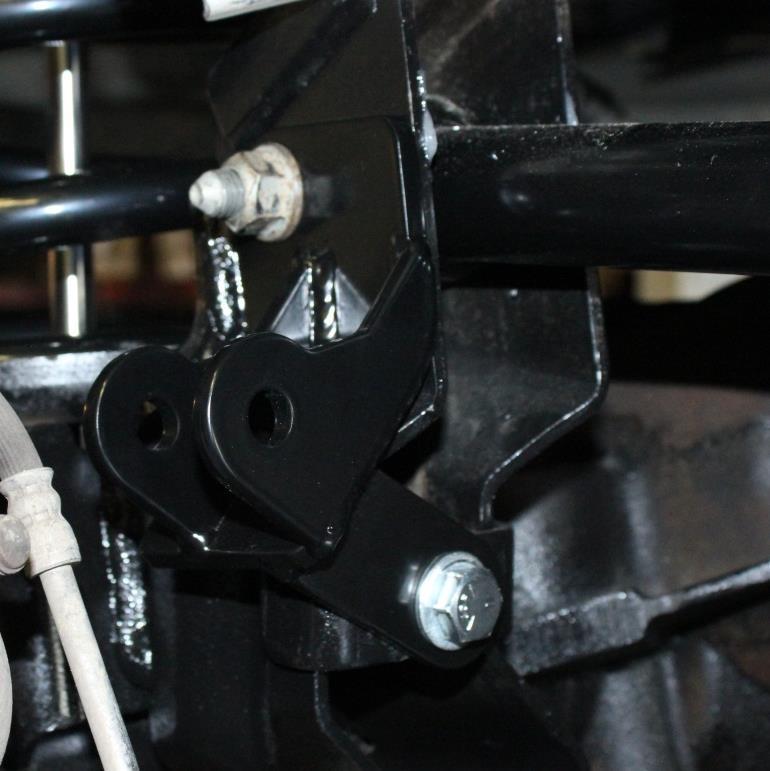 34) Install the front coil springs, put the shock inside the coil