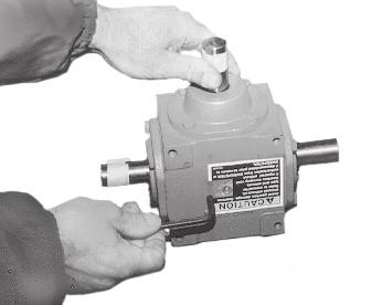 Tighten both plugs securely. figure 1 4. Reinstall the gearbox (figure 4).