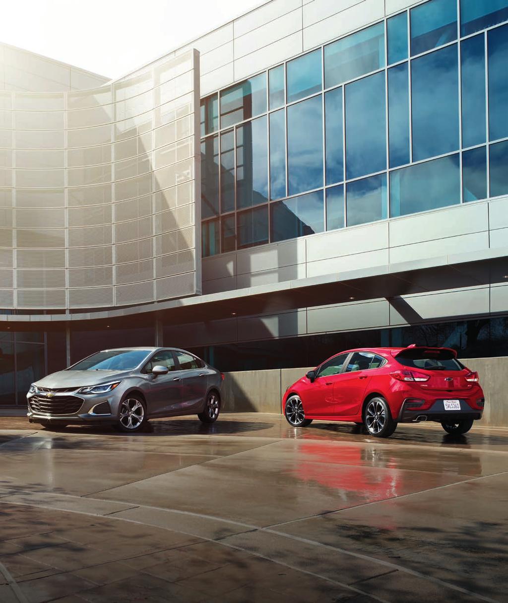 Cruze Premier Sedan in Satin Steel Gray Metallic and Cruze Premier Hatchback in Red Hot with available RS Package. ESCAPE THE ORDINARY AND GO THE DISTANCE.