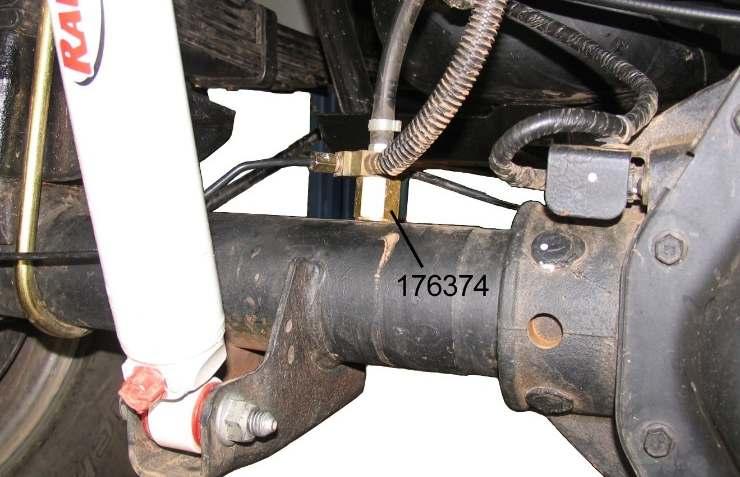 Illustration 22 4) Using brake hanger RS176381 as a template, mark the mounting hole location on the frame rail as shown in Illustration 22. Drill a 11/32 hole.