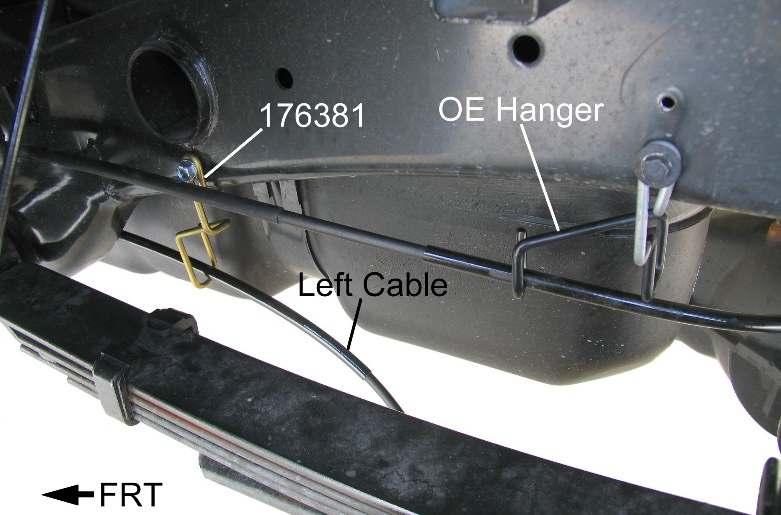 6) Insert left brake cable through the new hanger, under the frame and through the original bracket hole. Lock the fitting tabs into the hole. 7) Reattach the brake cable.