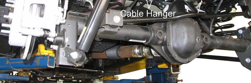 5) Remove bolts and separate the brake hoses from the frame rails. Remove clips holding ABS wire to frame. If necessary, disconnect any vent hoses and electrical wiring from the axle.
