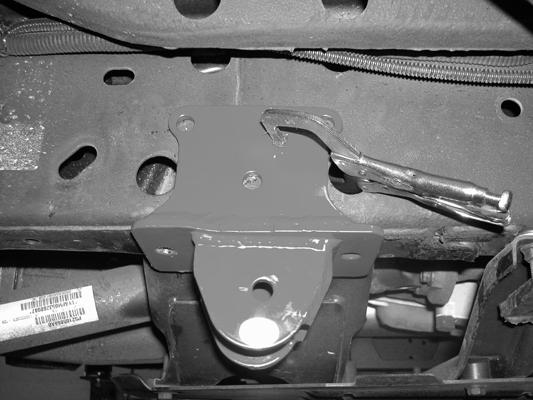 11. Starting on the driver s side, hold the rear link arm bracket (FTS3400-106D) against the frame. Make sure the bracket sits flush onto the frame.