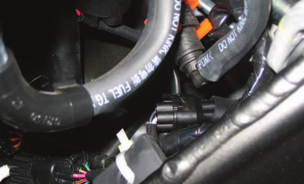 FIG.G 11 Locate the stock O2 sensor connection. This connection is located under the fuel tank near the right hand side of the frame. This is a black 4-pin connector.