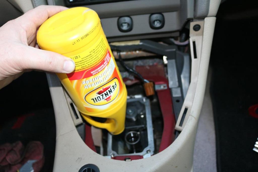 29. Add 3.2 quarts transmission fluid, the easiest method is via the gaping hole where the shifter is currently not.